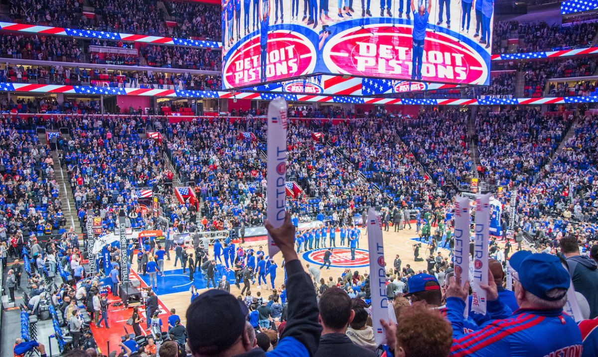 A crowd of people watching the best NBA team, the Detroit Pistons