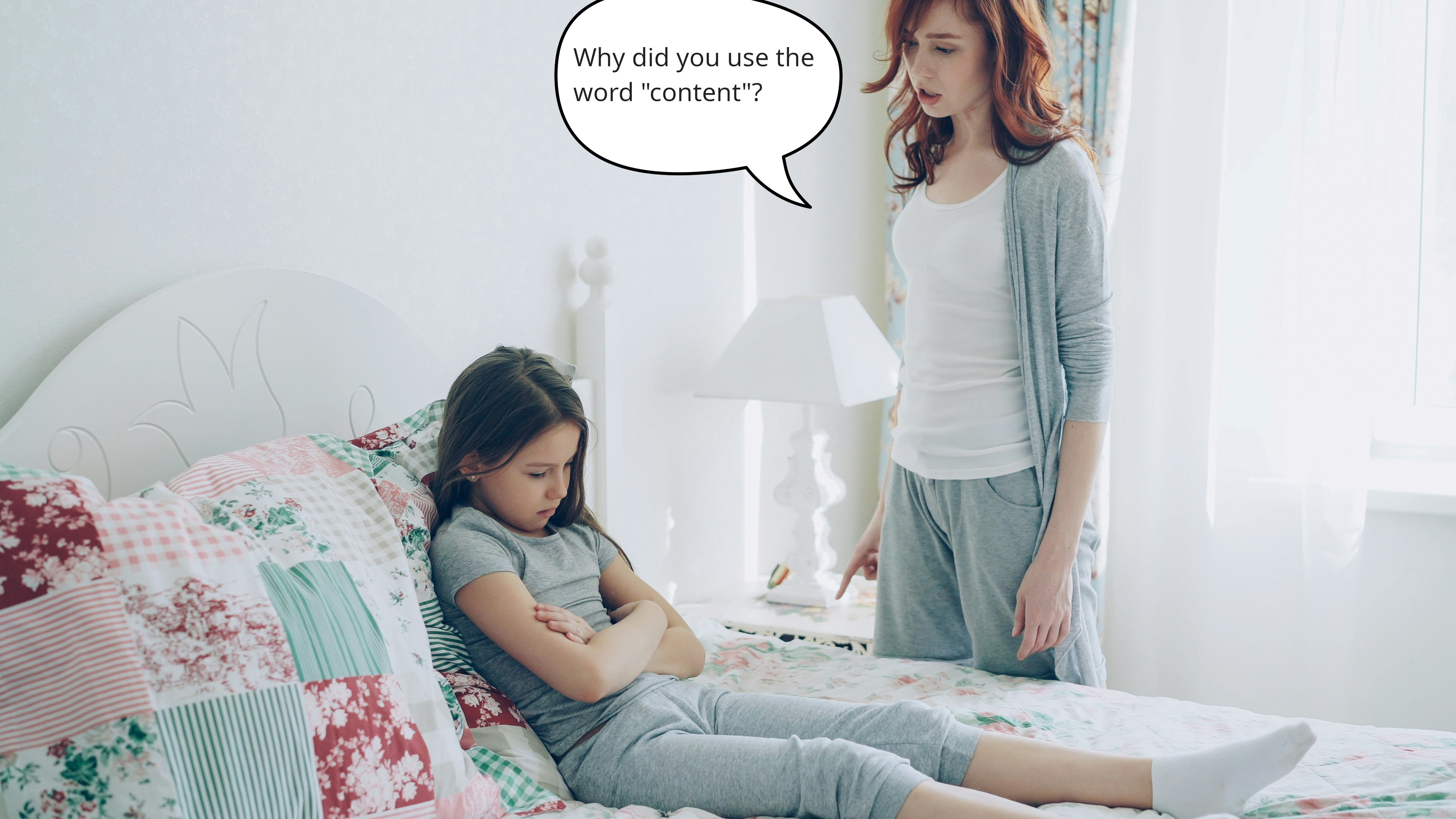 A woman scolding a child on a bed