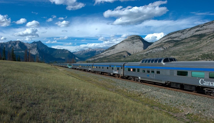 A Canada rail train traveling near mountains