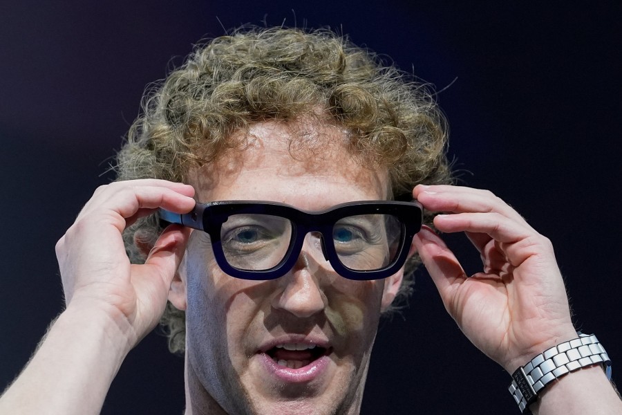 Mark Zuckerberg putting on large, goofy looking glasses that apparently we need to wear to spy on one another